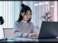 A_young_Korean_woman_sitting_at_a_desk_interactin-1738811172896.jpg